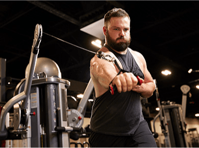 eos member exercising on cable machine 