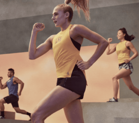 group of athletic people doing a step class